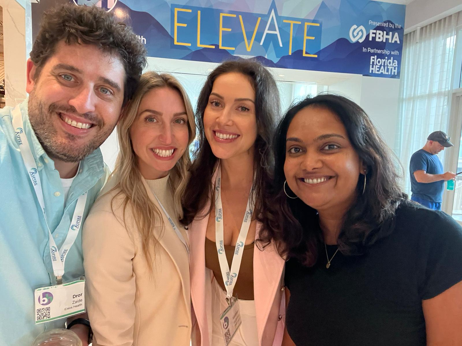 Eleos Health team members at a conference